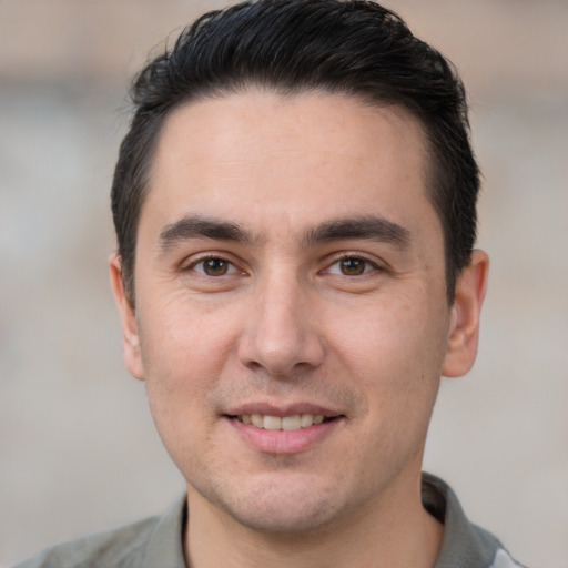 Joyful white young-adult male with short  brown hair and brown eyes