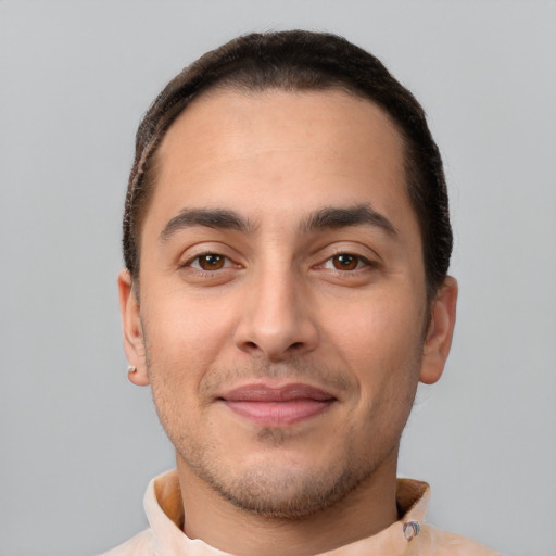 Joyful white young-adult male with short  brown hair and brown eyes