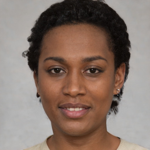 Neutral black young-adult female with short  black hair and brown eyes
