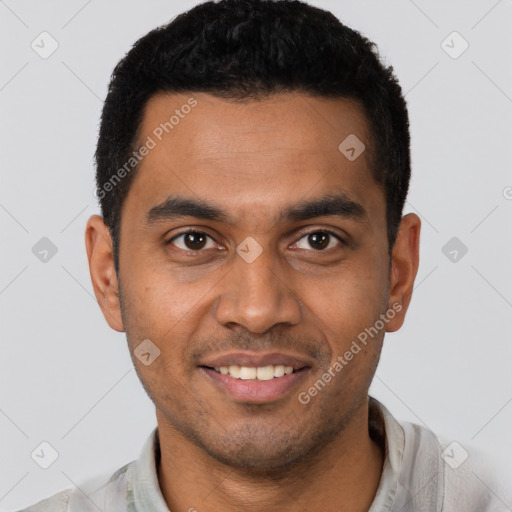 Joyful latino young-adult male with short  brown hair and brown eyes