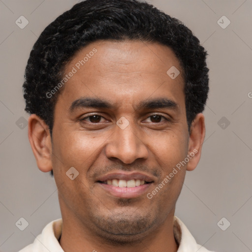 Joyful latino young-adult male with short  brown hair and brown eyes