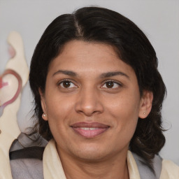 Joyful white adult female with medium  brown hair and brown eyes