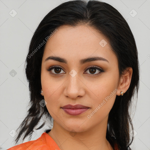 Joyful latino young-adult female with medium  brown hair and brown eyes