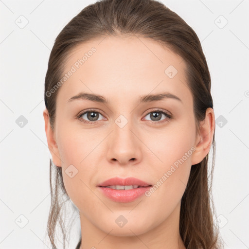 Joyful white young-adult female with long  brown hair and grey eyes