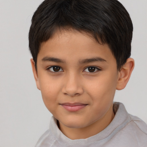 Joyful asian child female with short  brown hair and brown eyes