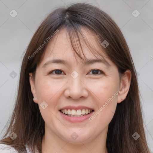 Joyful white adult female with medium  brown hair and brown eyes