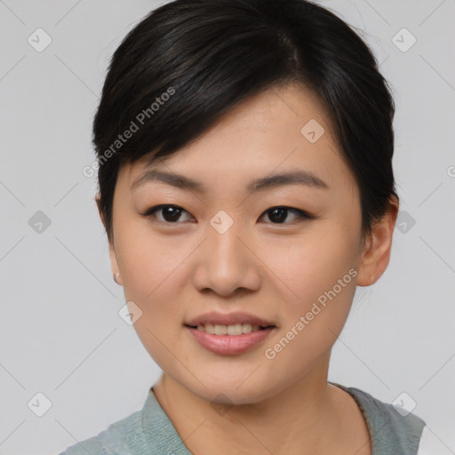 Joyful asian young-adult female with short  brown hair and brown eyes