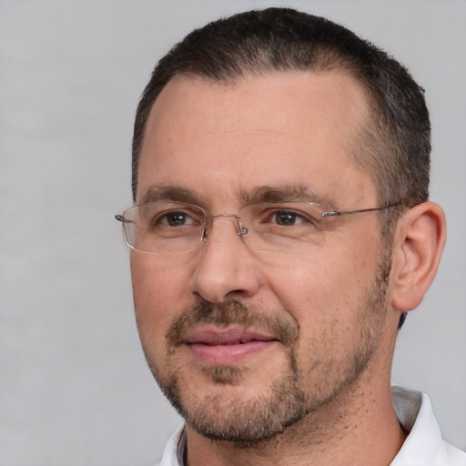 Joyful white adult male with short  brown hair and brown eyes