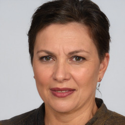 Joyful white adult female with short  brown hair and brown eyes