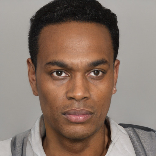 Neutral black young-adult male with short  black hair and brown eyes