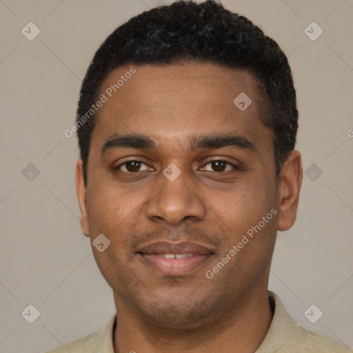 Joyful black young-adult male with short  black hair and brown eyes