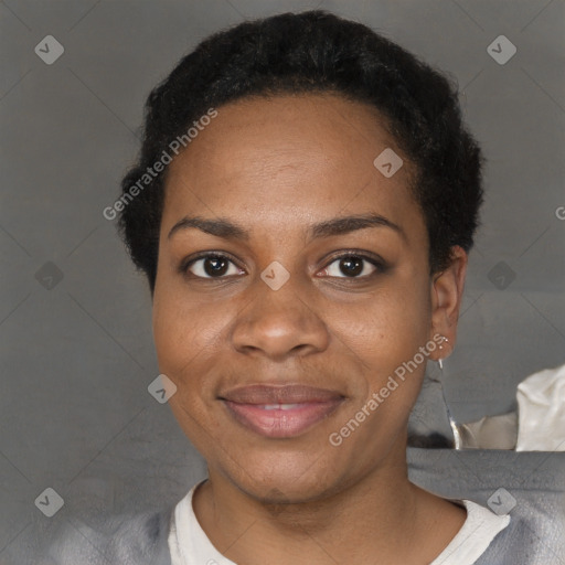 Joyful black adult female with short  black hair and brown eyes