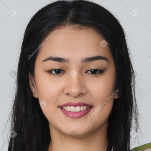 Joyful asian young-adult female with long  brown hair and brown eyes