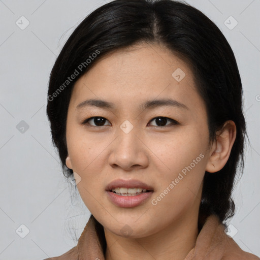 Joyful asian young-adult female with medium  black hair and brown eyes