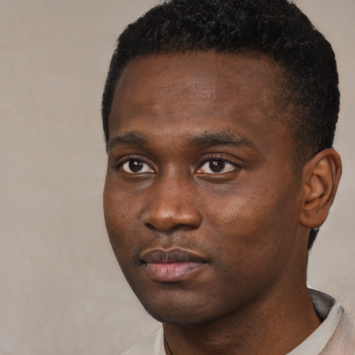 Neutral black young-adult male with short  brown hair and brown eyes