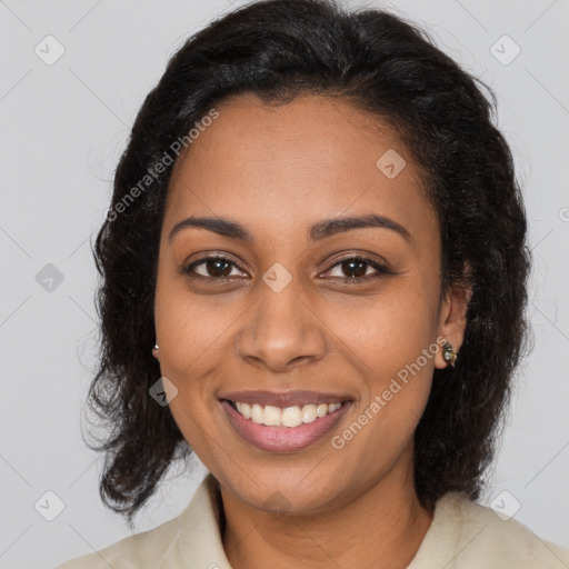 Joyful black young-adult female with medium  brown hair and brown eyes