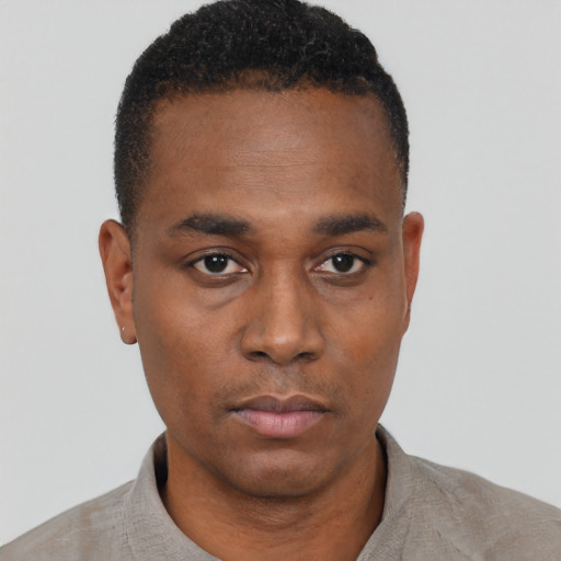 Neutral black young-adult male with short  black hair and brown eyes