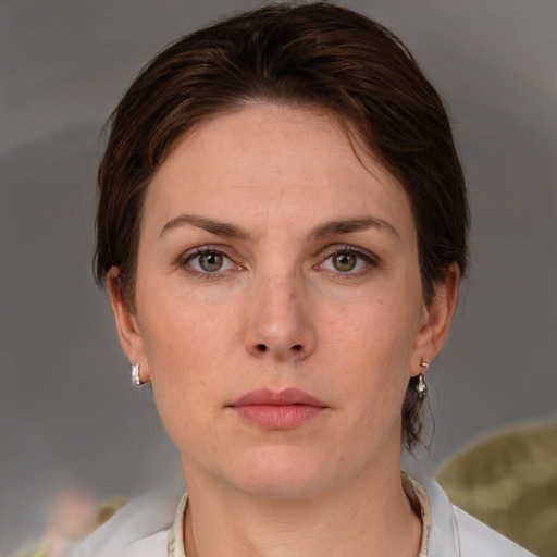 Neutral white adult female with short  brown hair and grey eyes