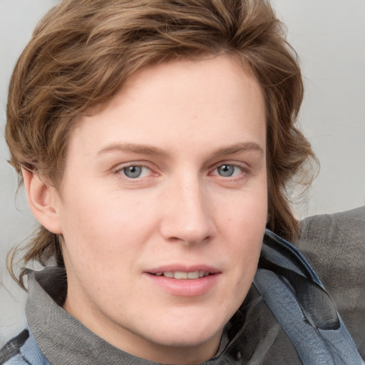 Joyful white young-adult female with medium  brown hair and blue eyes