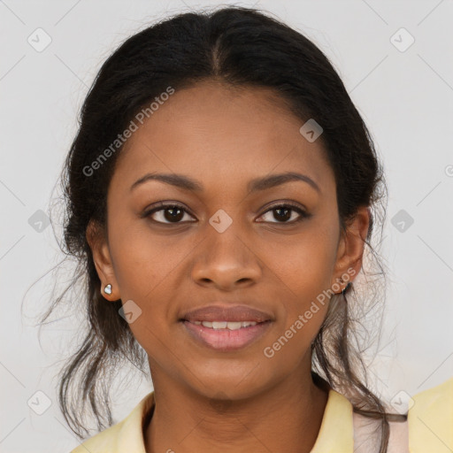 Joyful black young-adult female with long  brown hair and brown eyes