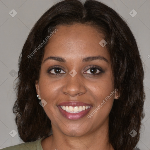 Joyful black adult female with medium  brown hair and brown eyes