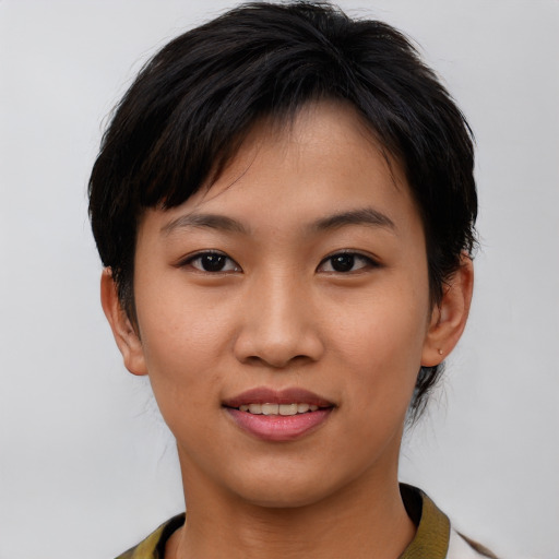 Joyful asian young-adult female with short  brown hair and brown eyes