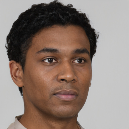 Neutral black young-adult male with short  brown hair and brown eyes