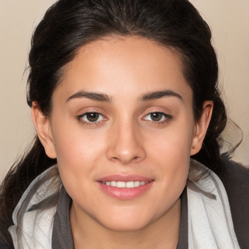 Joyful white young-adult female with medium  brown hair and brown eyes