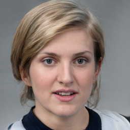 Joyful white young-adult female with medium  brown hair and blue eyes