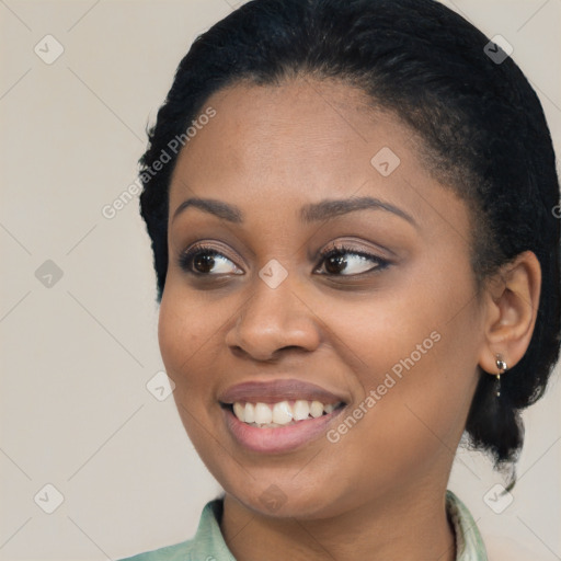 Joyful black young-adult female with medium  black hair and brown eyes