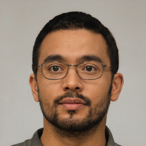 Neutral latino young-adult male with short  black hair and brown eyes