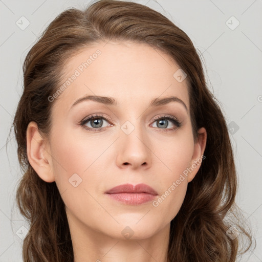 Joyful white young-adult female with long  brown hair and blue eyes