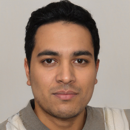 Neutral latino young-adult male with short  black hair and brown eyes