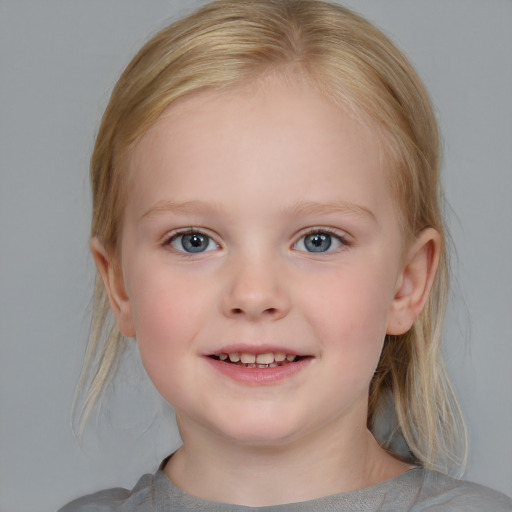 Joyful white child female with medium  brown hair and blue eyes