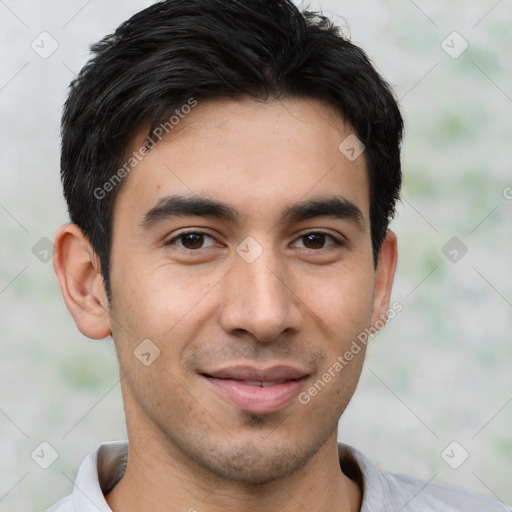 Joyful latino young-adult male with short  black hair and brown eyes