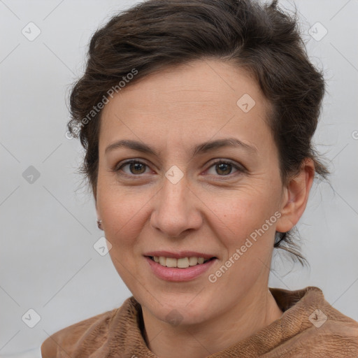 Joyful white adult female with short  brown hair and brown eyes