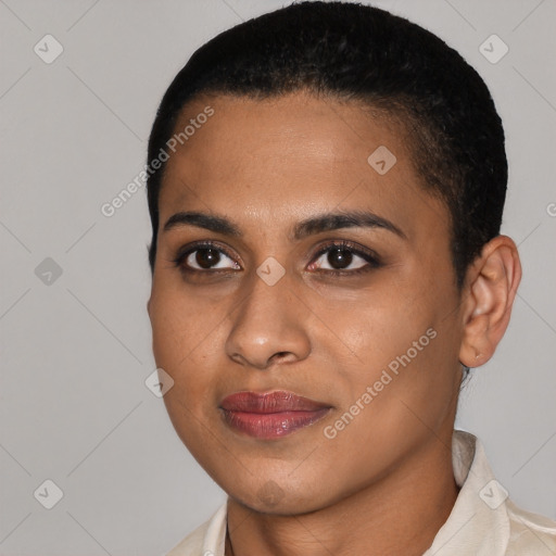 Joyful black young-adult female with short  black hair and brown eyes