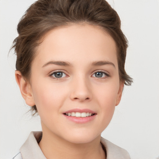 Joyful white child female with short  brown hair and brown eyes