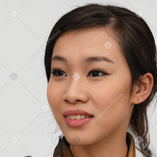 Joyful asian young-adult female with long  brown hair and brown eyes