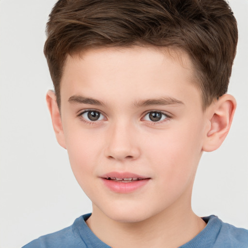 Joyful white child male with short  brown hair and brown eyes