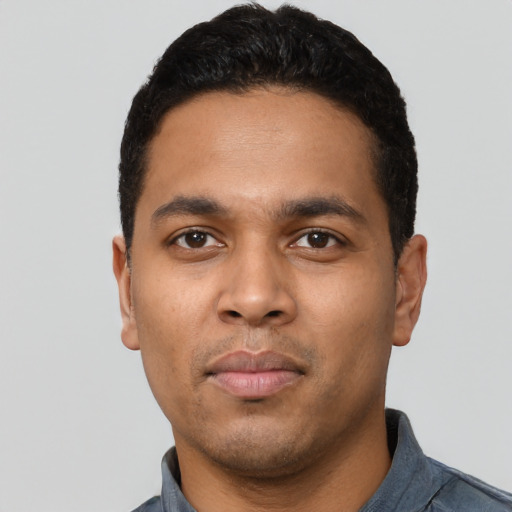 Neutral latino young-adult male with short  black hair and brown eyes