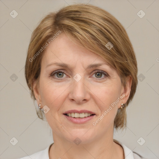 Joyful white adult female with medium  brown hair and grey eyes