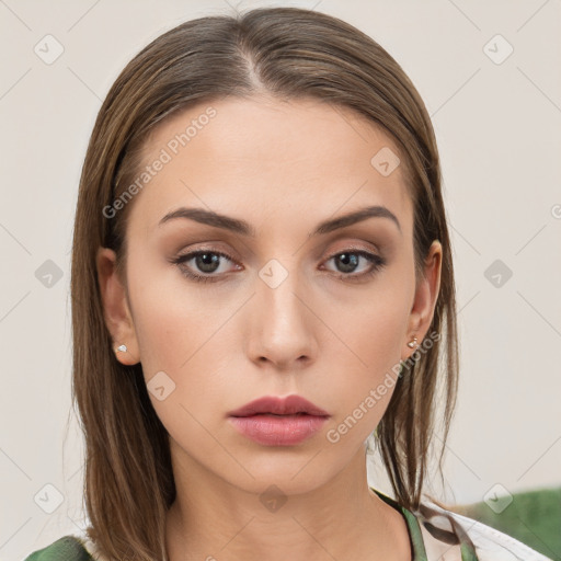 Neutral white young-adult female with long  brown hair and brown eyes