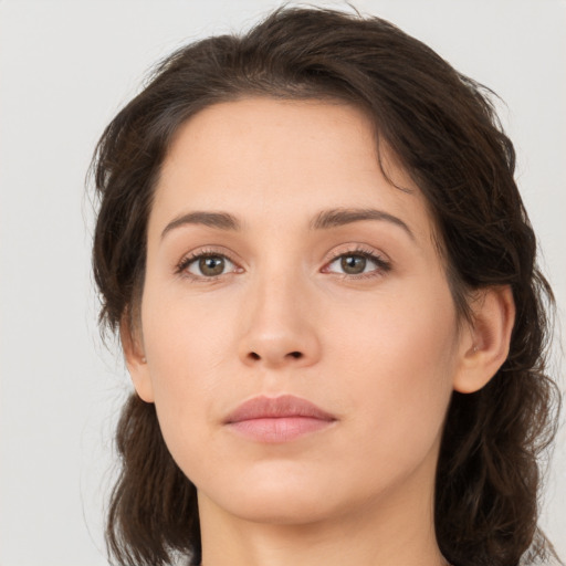 Neutral white young-adult female with medium  brown hair and brown eyes