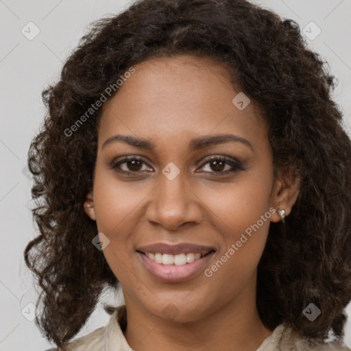 Joyful black young-adult female with medium  brown hair and brown eyes