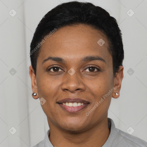 Joyful black young-adult female with short  black hair and brown eyes