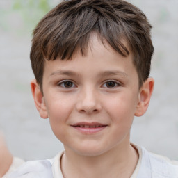 Joyful white child male with short  brown hair and brown eyes