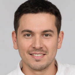 Joyful white young-adult male with short  brown hair and brown eyes