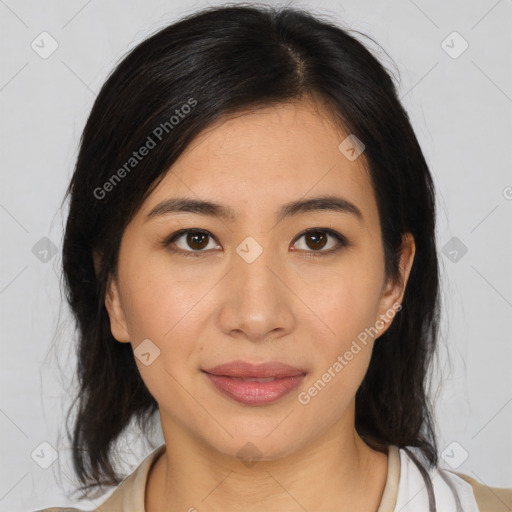 Joyful latino young-adult female with medium  brown hair and brown eyes