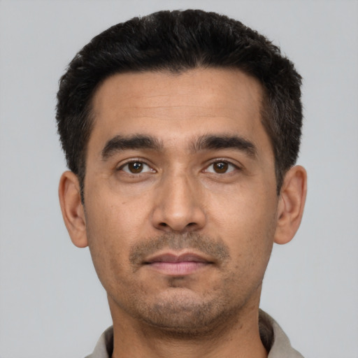 Neutral white young-adult male with short  black hair and brown eyes